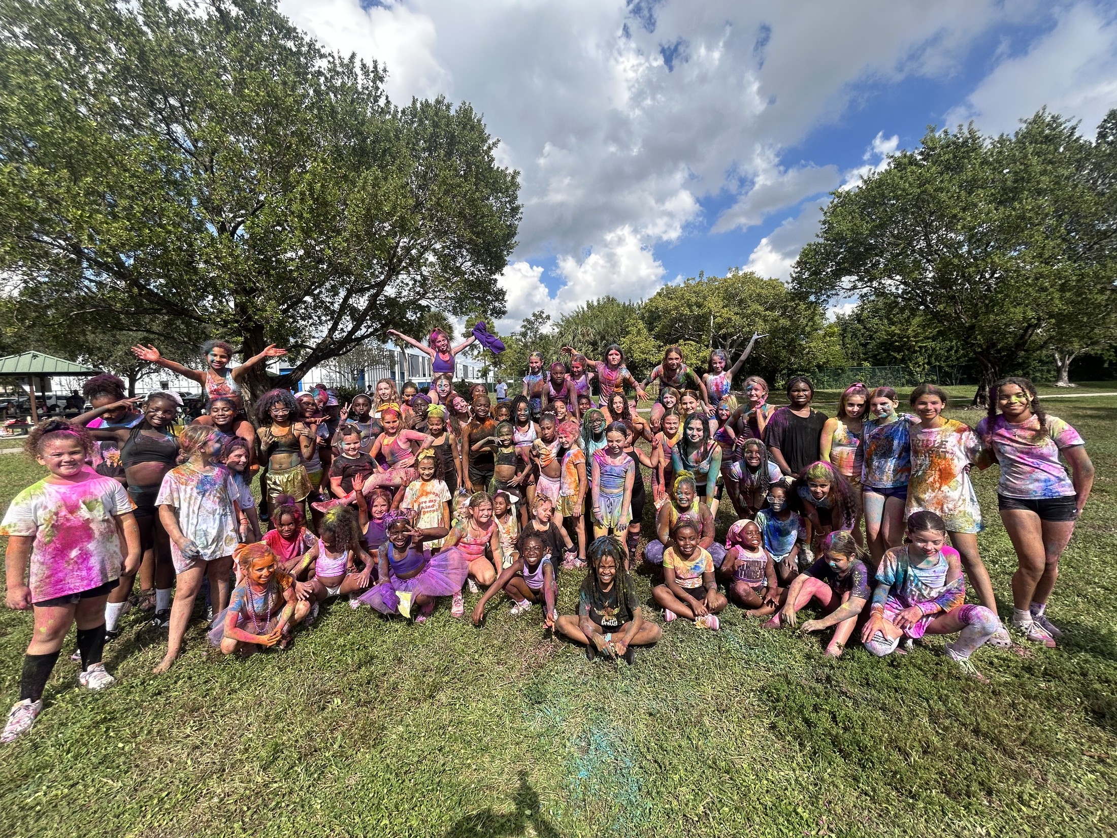F3T team together outdoors, celebrating as one big family