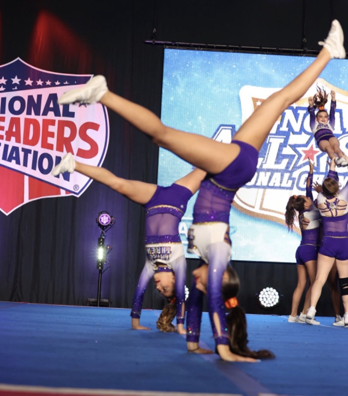 F3T athletes tumbling on stage at NCA Nationals