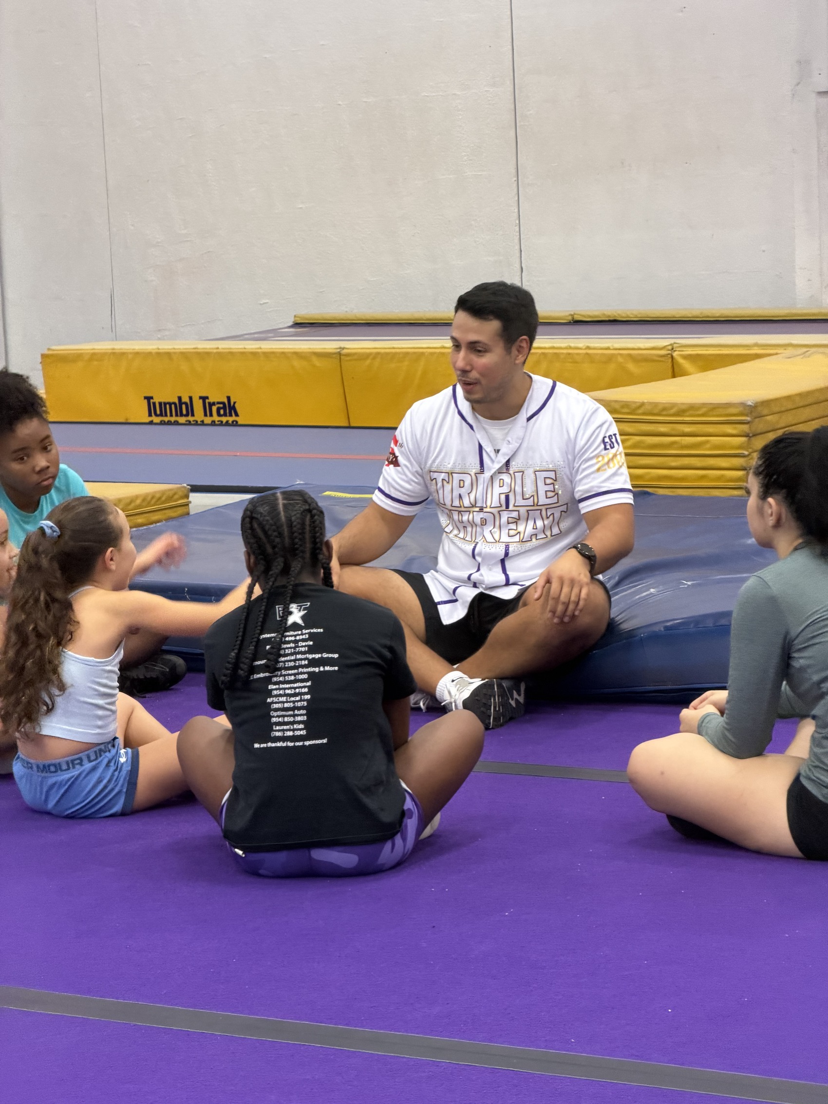 F3T coach working with young athletes