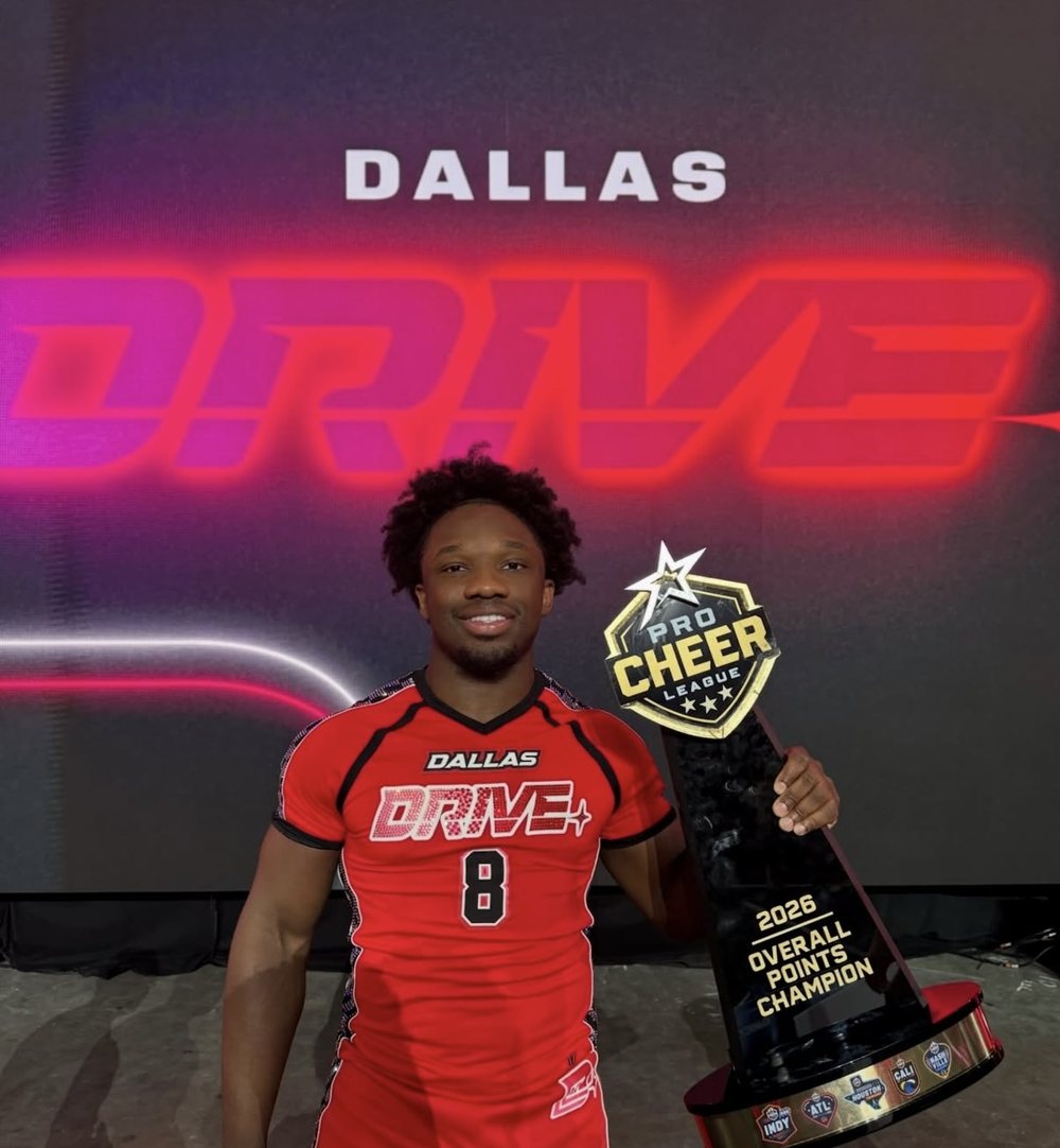 Coach Benji with the 2026 Pro Cheer League Overall Points Champion trophy, Dallas Drive