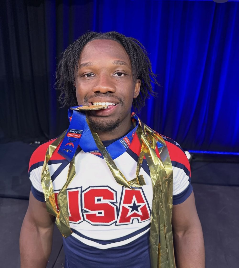Coach Benji with his ICU World Championship gold medal, Team USA
